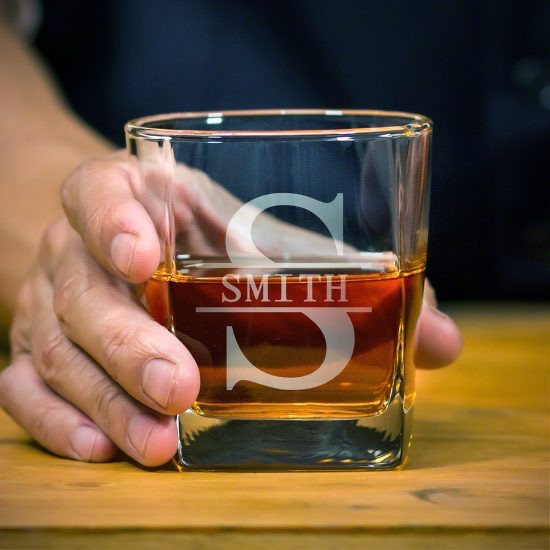 Man holding a Rutherford style whiskey glass