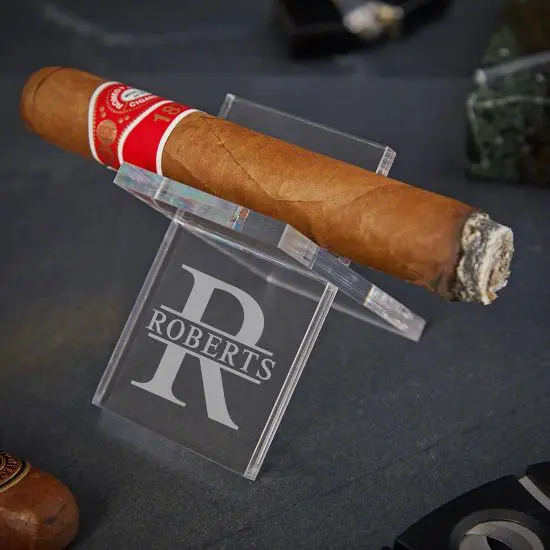 Personalized cigar stand with lit cigar