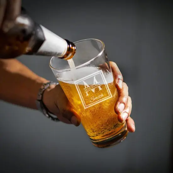 Pouring beer into pint glass
