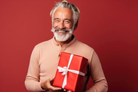 Retired man holding gift