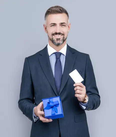 Man in suit opening his corporate gift for clients