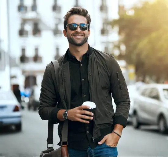 Cool 40 year old in the street holding coffee