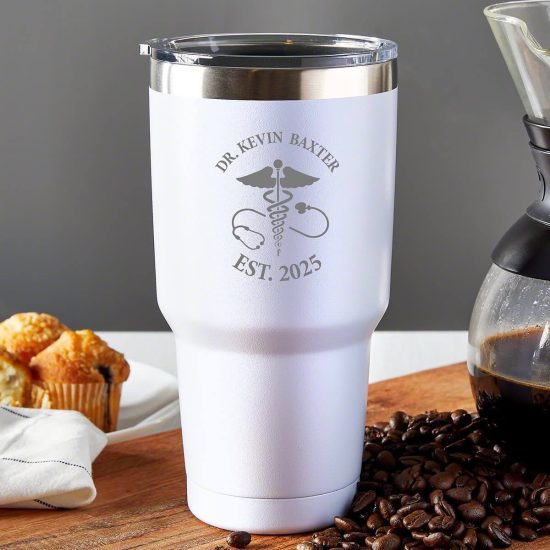 Custom white tumbler surrounded by coffee beans