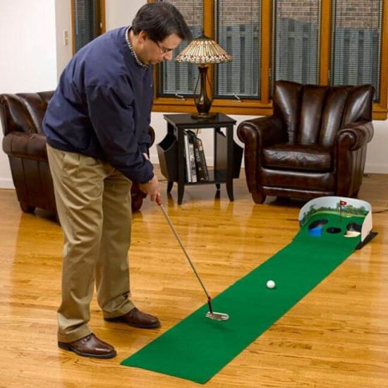 Man using electric putter and return putting green
