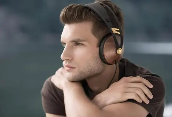 Man wearing headphones looking into distance