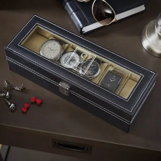 Black leather watch case on table