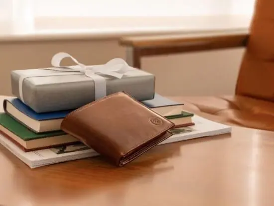 Vittore leather wallet sitting on a table