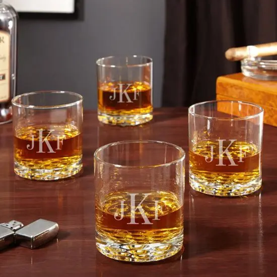 Four Buckman whiskey glasses full of whiskey
