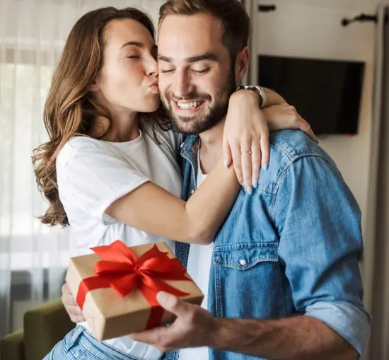 Woman giving her man an inexpensive gift