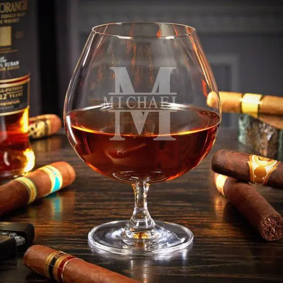 Single cognac glass with liquor inside