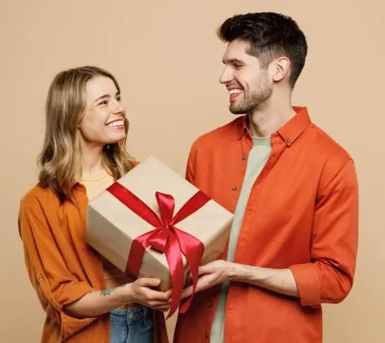 Couple holding 10 year anniversary gift