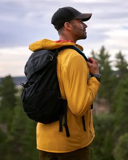 Man hiking wearing a Garmin smartwatch