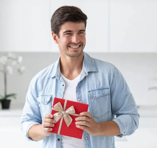Man holding cool gift for guys in a kitchen