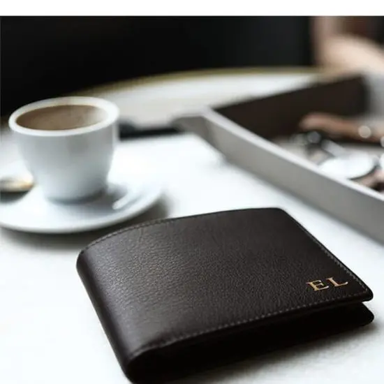 Classic leather wallet sitting on a coffee table