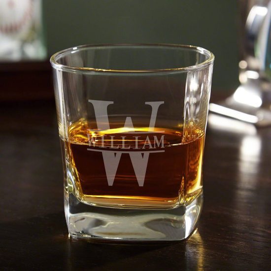 Old fashioned style whiskey glass with whiskey inside