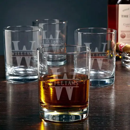 Set of four Eastham custom whiskey glasses with whiskey inside