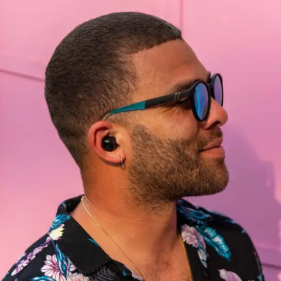 Man wearing affordable gifts for men wireless earbuds