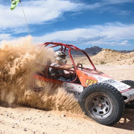 Dune buggy racing through the desert