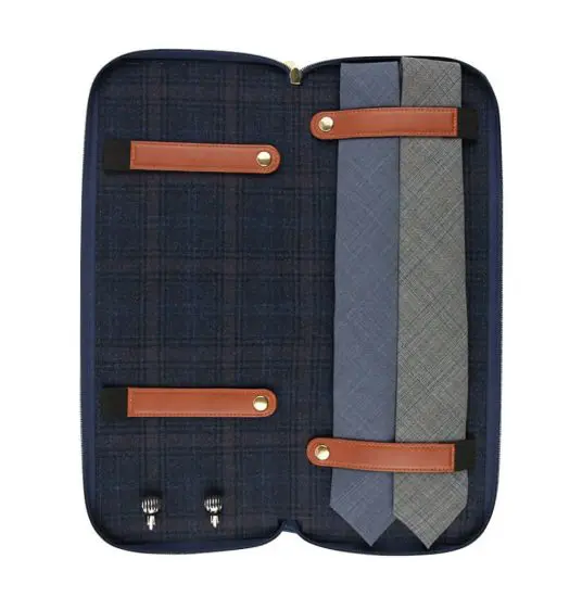 Two ties inside fancy tie travel case