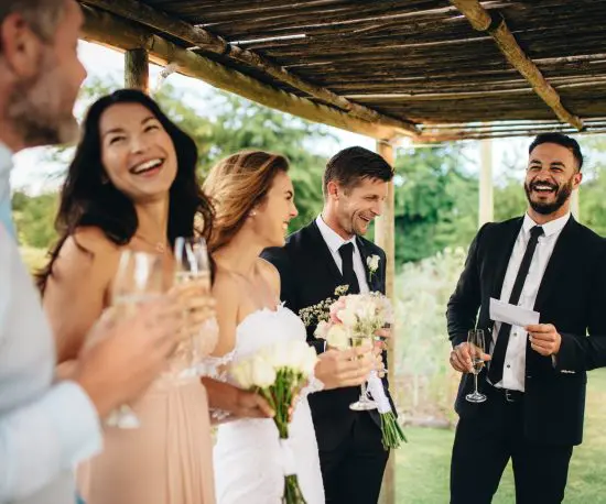 Photo of a happy wedding party giving a toast