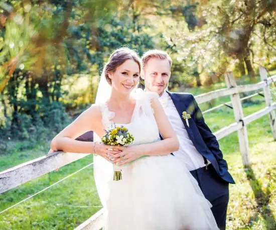 Portrait shot of a happy bride and groom outdoors