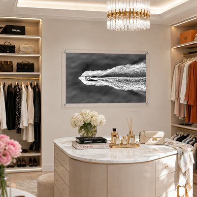 Horizontal acrylic wall art featuring an aerial view of a boat and ocean wake