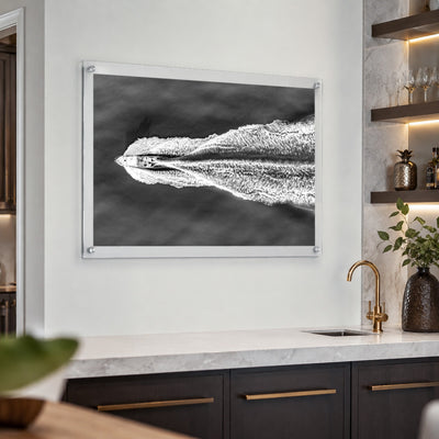 The Getaway black and white boat wall art with aerial ocean view