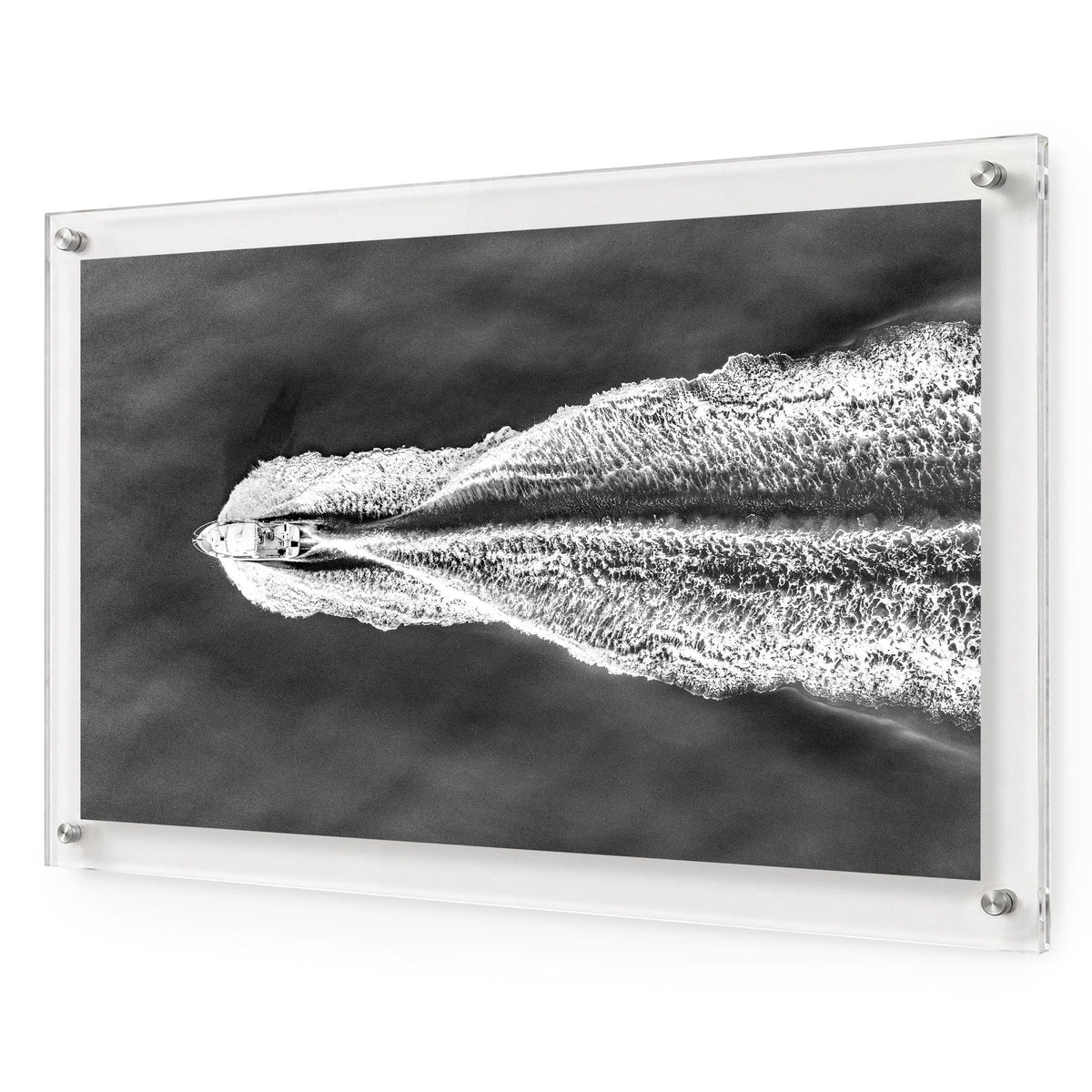 The Getaway black and white acrylic wall art featuring a speedboat on open water