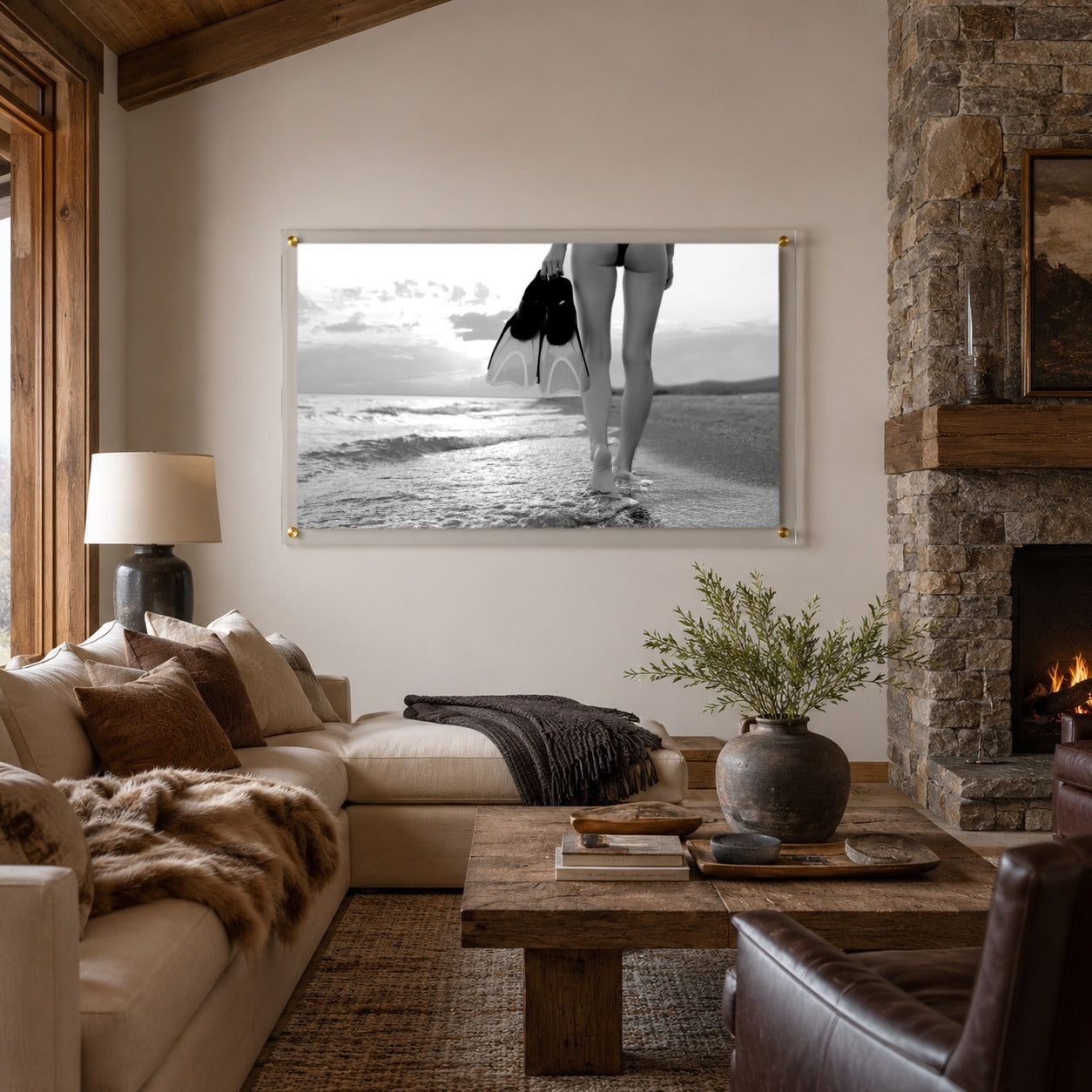 fins first black and white acrylic wall art in living room fireplace scene