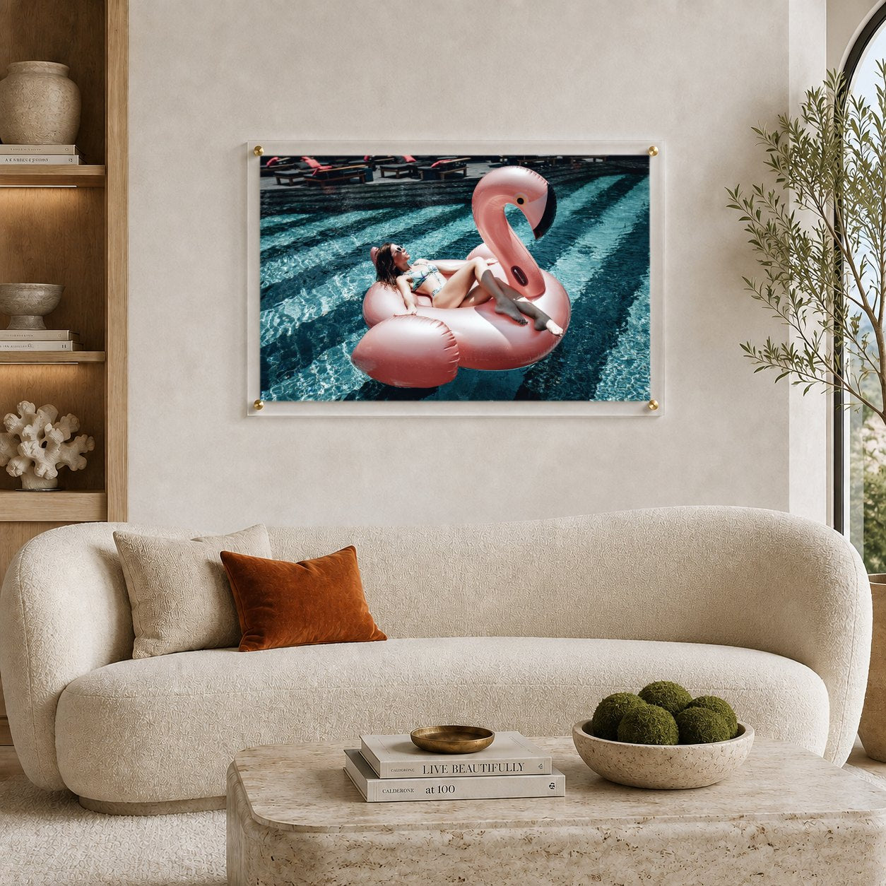 Pink flamingo pool wall art in a modern living room with upholstered chairs
