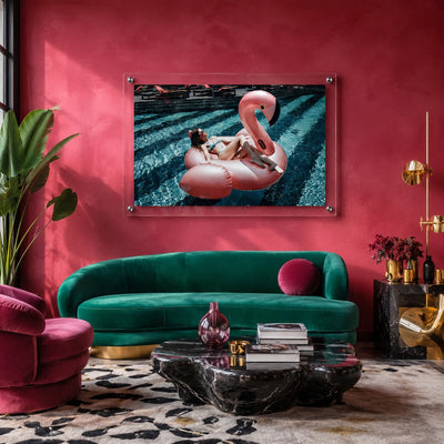 Pink flamingo pool wall art displayed in a colorful retro-inspired living room with green velvet sofa