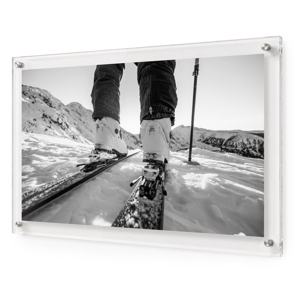 Black and white mountain road wall art hanging on white wall