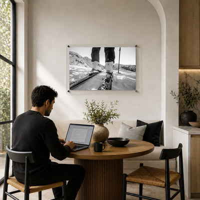 Black and white mountain road wall art displayed in a breakfast nook space