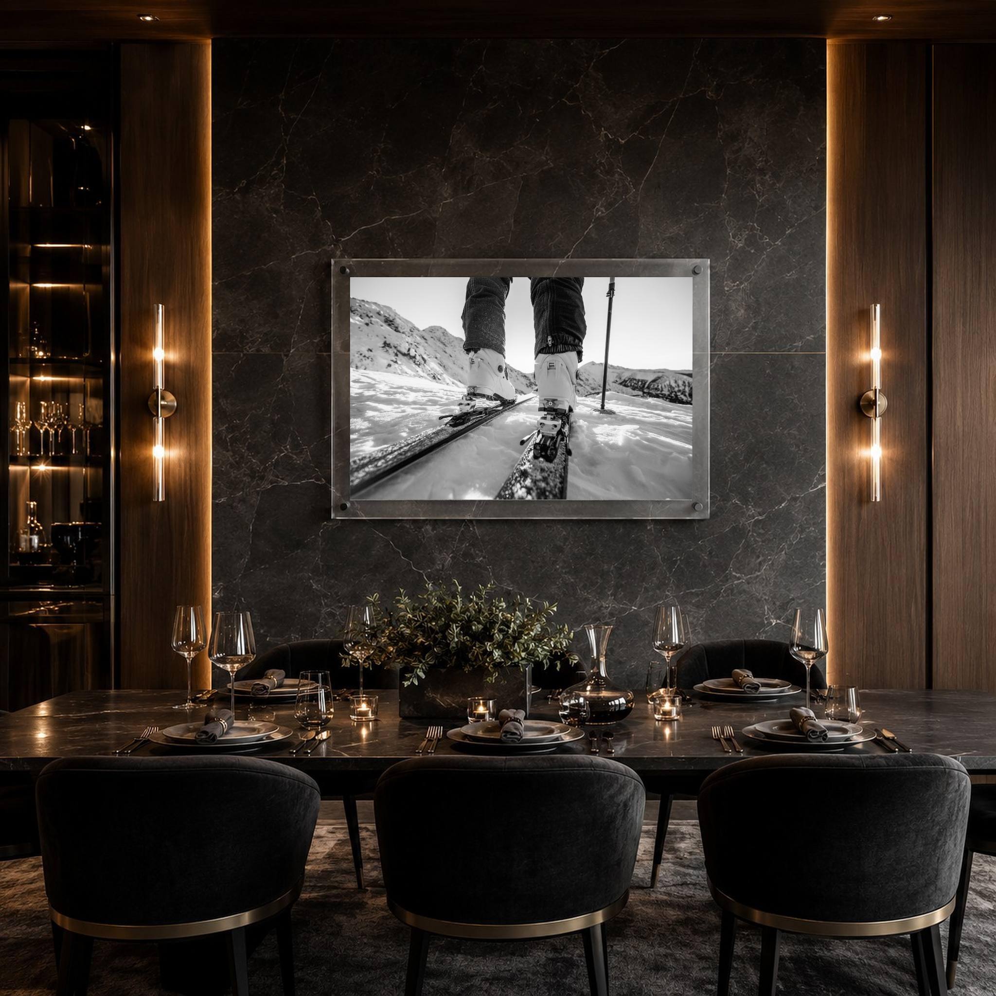 Black and white mountain road wall art in a modern black dining table and upholstered chairs