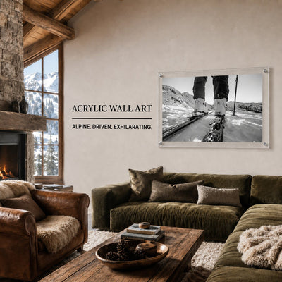 Black and white mountain road wall art displayed in a stylish living room scene