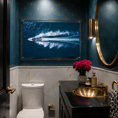 Exit By Sea wall art in a moody art deco powder room