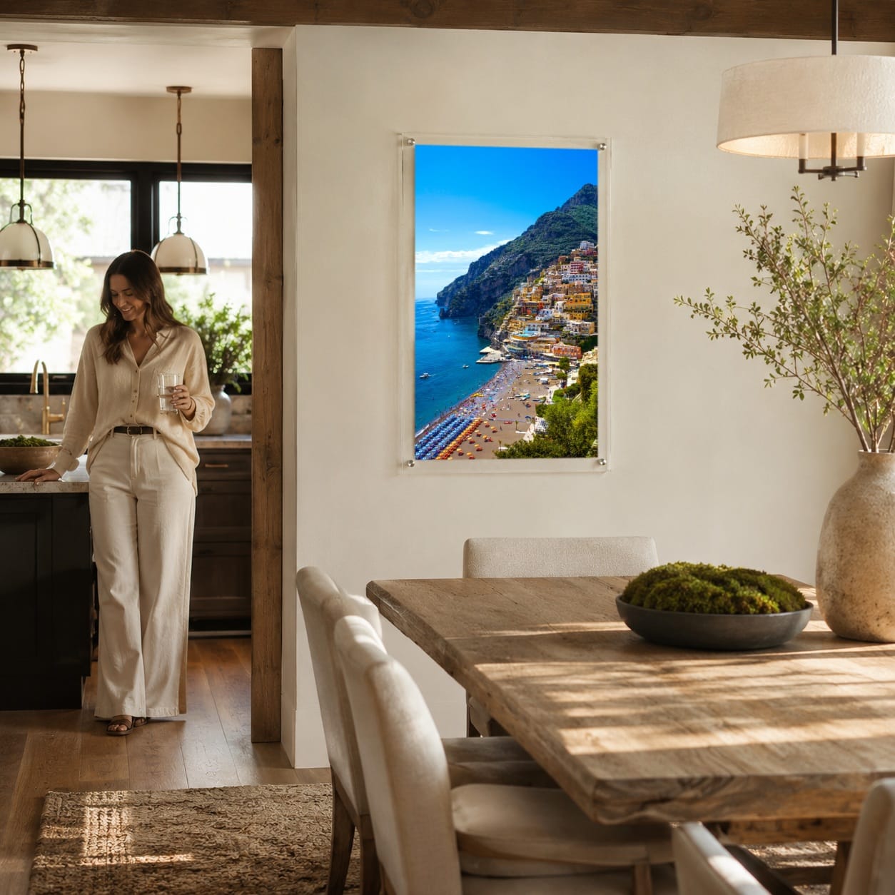 Positively Positano wall art in a warm modern dining room setting with woman standing