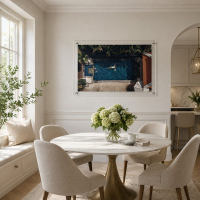 Lap of Luxury wall art in a bright room with a white modern dining table