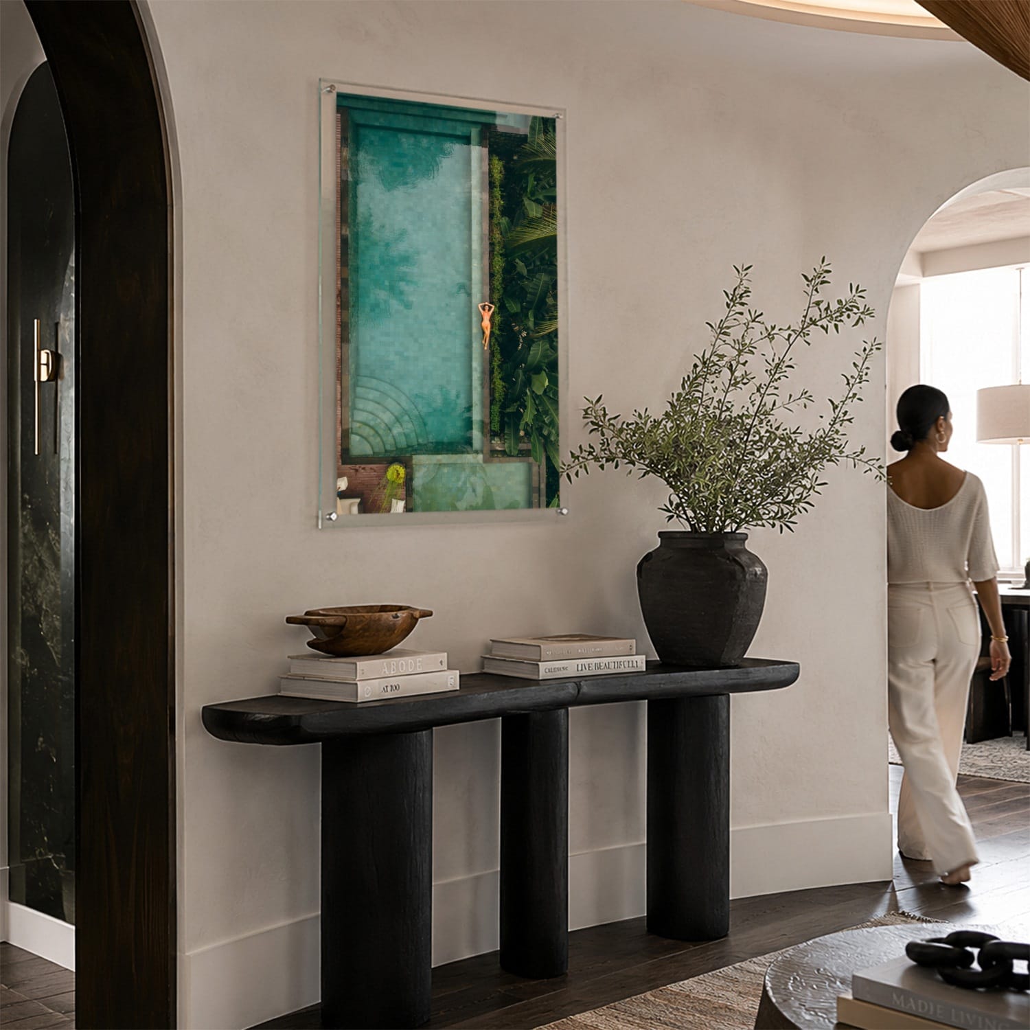 Palm and Circumstance wall art in an elegant modern foyer space with woman aside