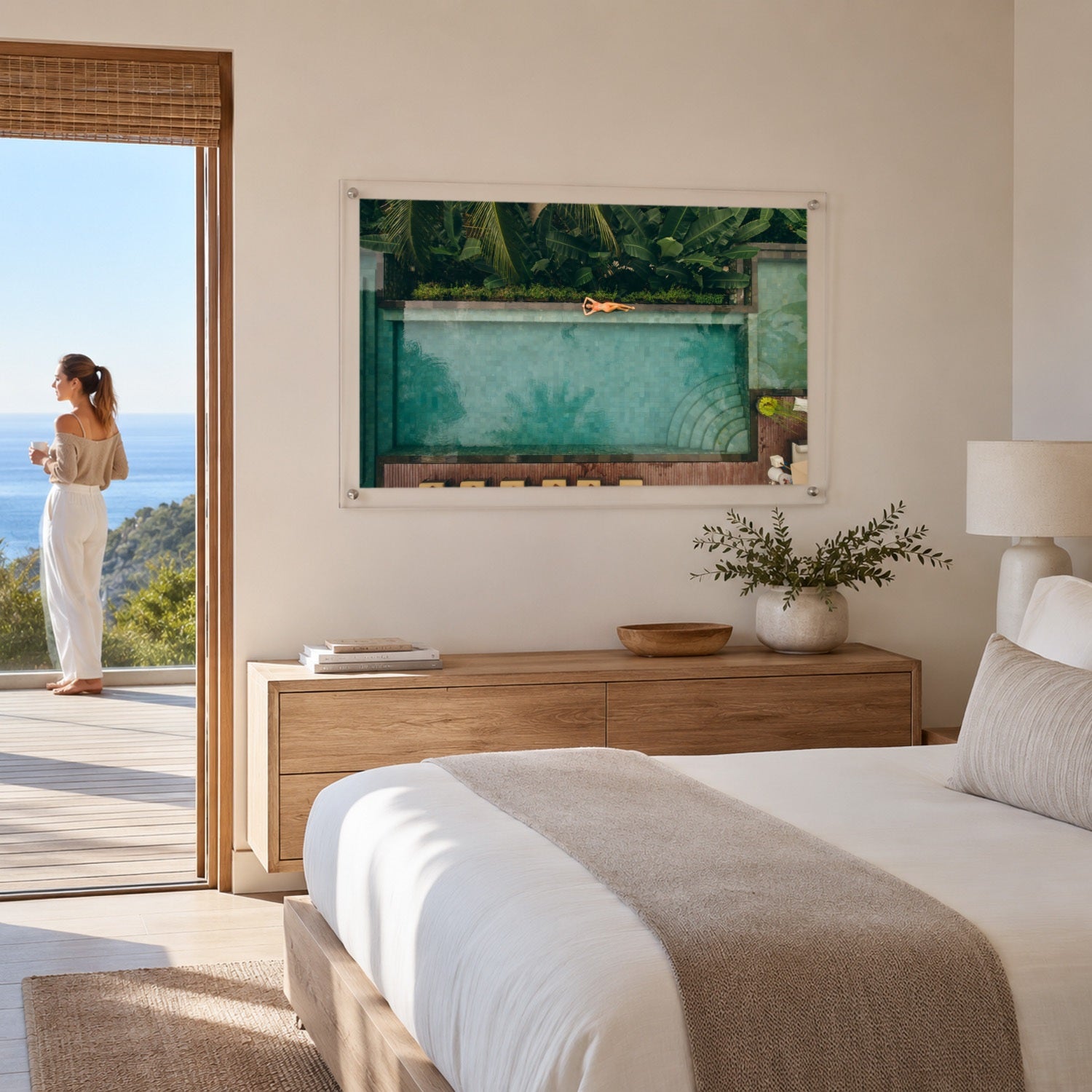 Palm and Circumstance wall art displayed in a bright room space with woman outside
