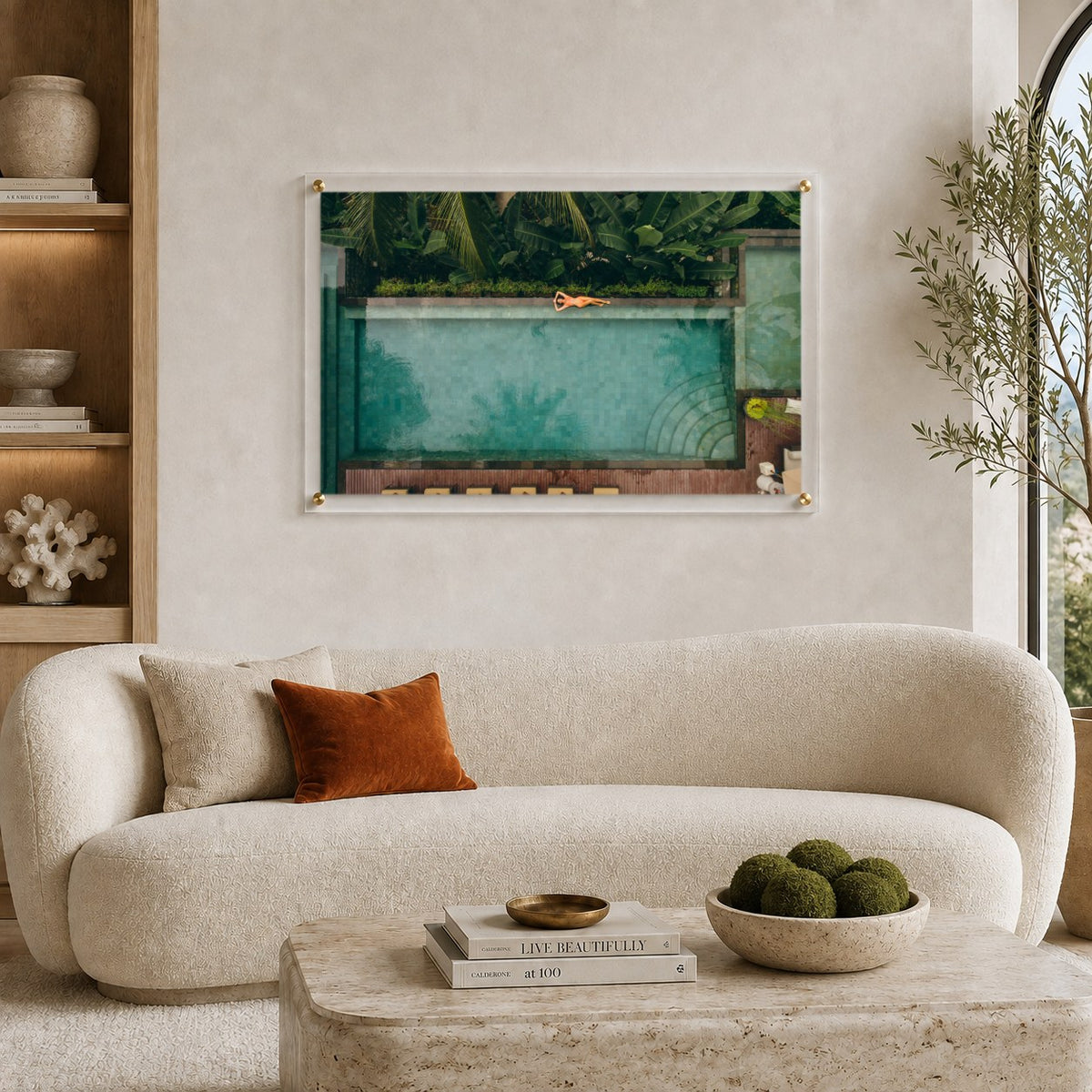 Palm and Circumstance wall art displayed above a sofa in a living room