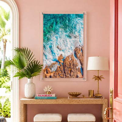 Foam and Fire wall art in a colorful pink entryway with console