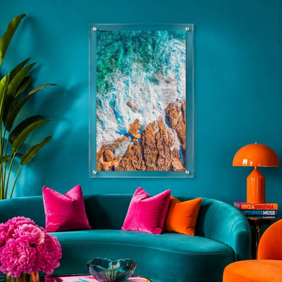 Foam and Fire wall art in a vibrant teal lounge with sofa decor