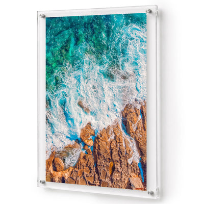 Ocean in Motion wall art shown in a vertical acrylic frame decor