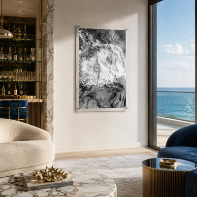 Vertical black and white ocean wall art in a modern home bar interior