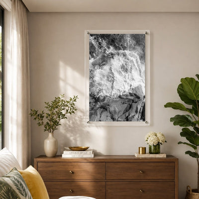 Modern coastal wall art displayed above a console cabinet