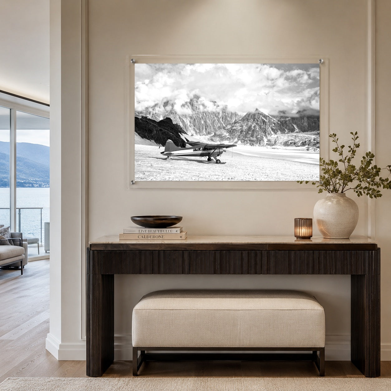 Where Adventure Begins acrylic wall art above a modern entry console table with lake view