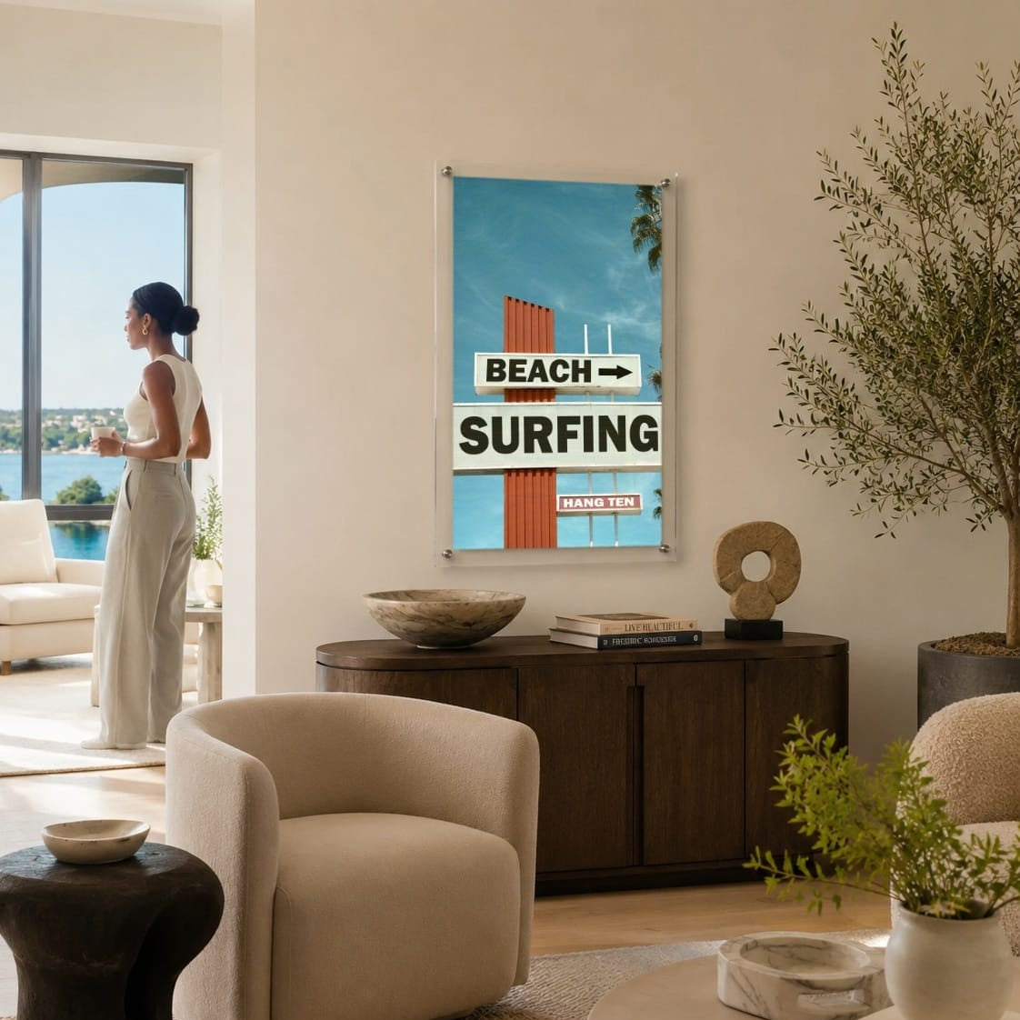 Next Stop Surf acrylic wall art in a bright living room scene with woman looking afar