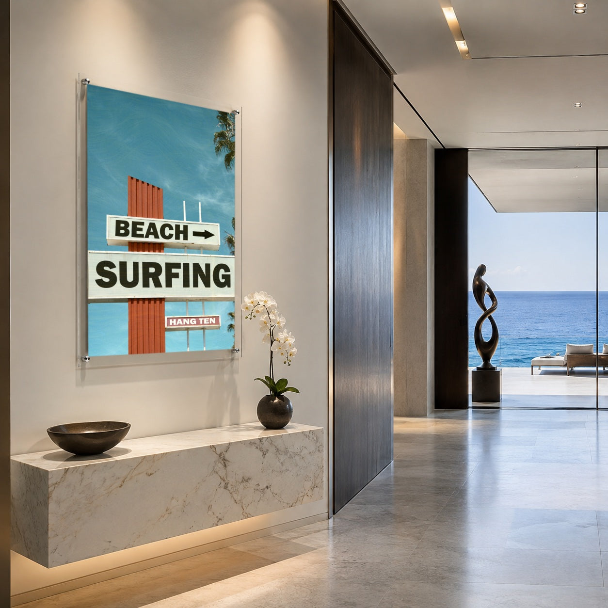 Next Stop Surf acrylic wall art in a modern coastal hallway scene with ocean view