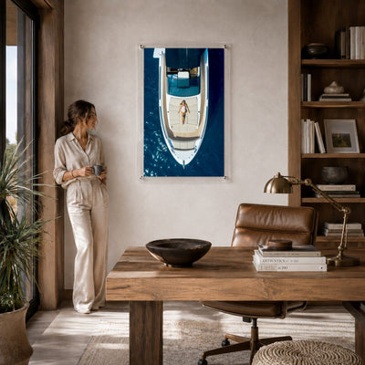 First Class Afloat acrylic wall art in a modern workspace room scene with woman standing aside